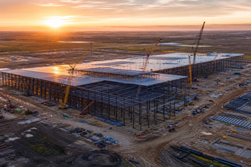 Aerial view of steel framework of Tesla robot factory under construction in Texas