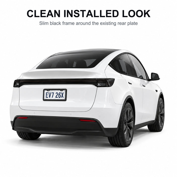 Matte black license plate frame installed around a white plate on an old-style white Tesla Model Y