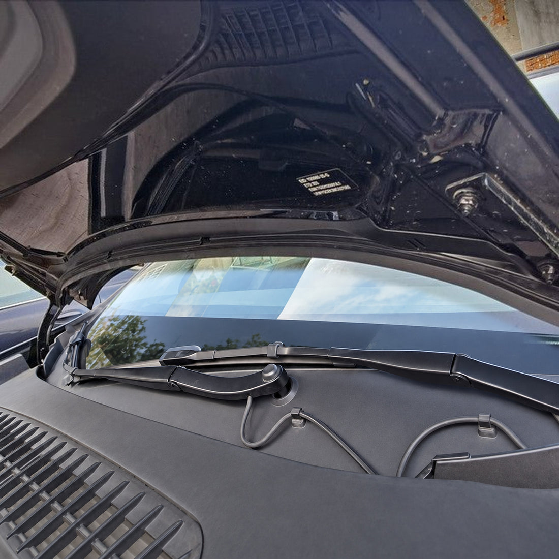 Black double-channel hood weatherstrip kit for pre-Juniper Tesla Model Y, showing the curved ABS support and separate rubber sealing strip on white.