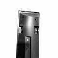 A close-up of a black plastic mounting bracket or panel with pre-drilled screw holes and metal fasteners, shown against a plain white background.