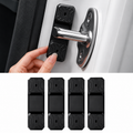 Four black door stopper pads shown with a hand pressing one into place on a white car door, plus a bottom row of four loose stoppers for scale.