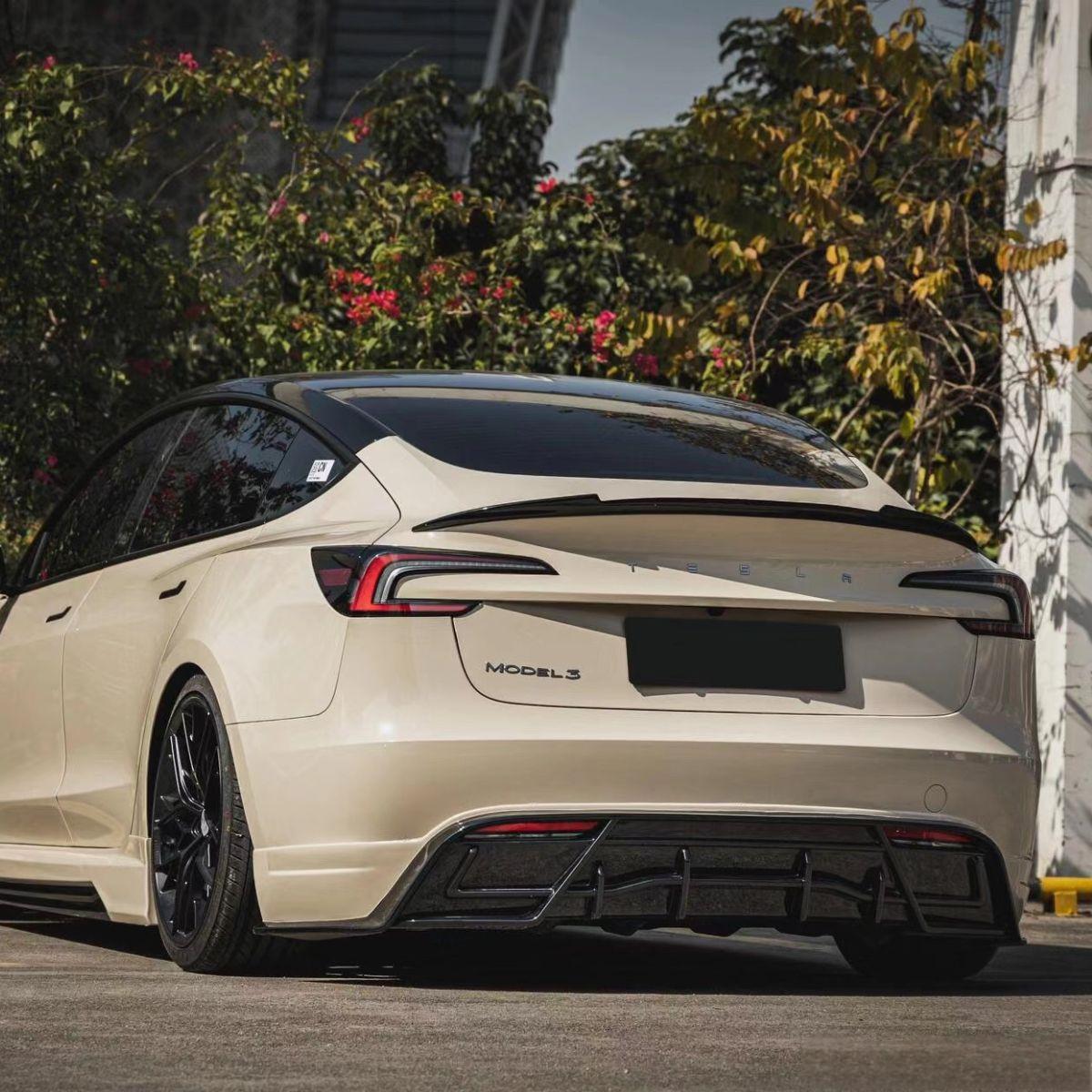 Three-quarter rear view of a Model 3 Highland with the carbon fiber spoiler installed