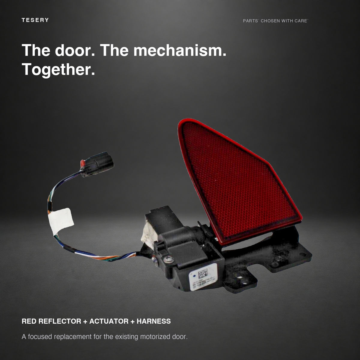 Tesla Model S charge door with integrated hinge actuator and attached harness on graphite background